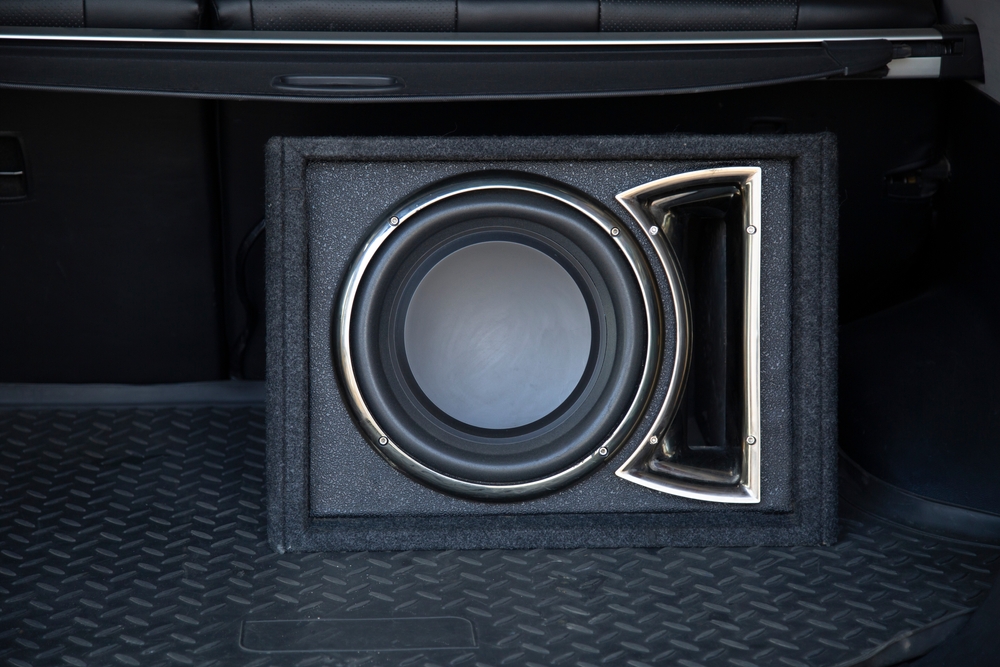 Custom subwoofer enclosure installed in a car trunk