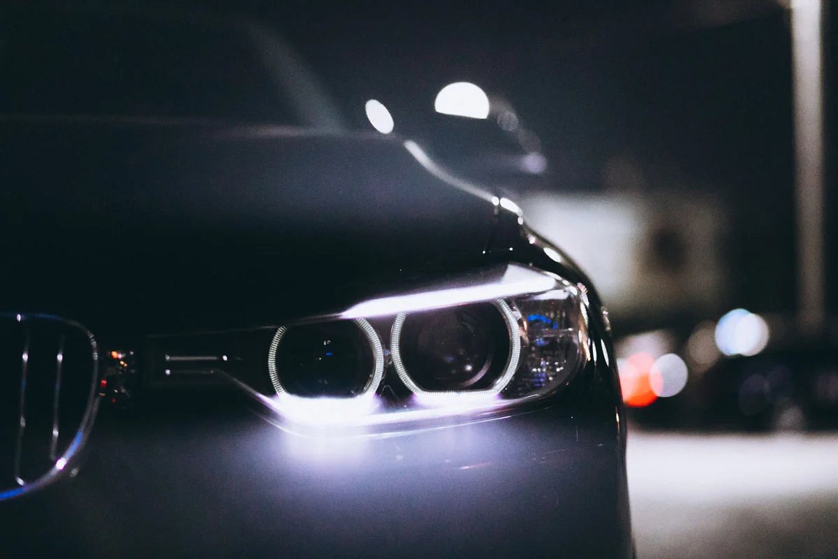 Car LED headlight glowing at night