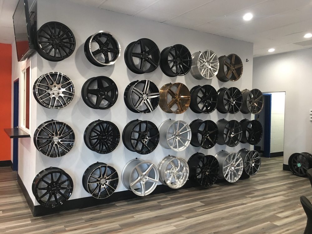 Wall of rims on display inside the shop