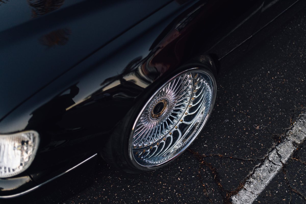 Chrome rims on a black car